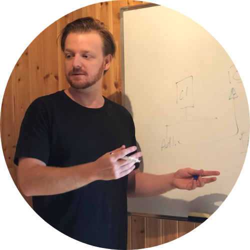 Photo of the author Andrew Dunn in a black shirt