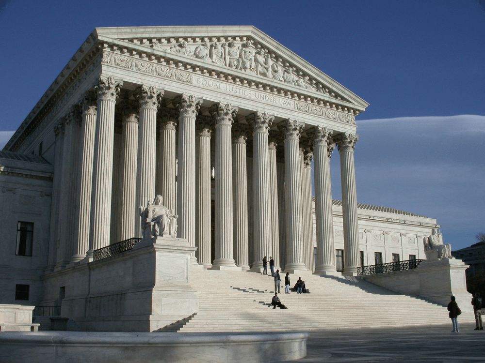 A courthouse with a blue sky in the background.