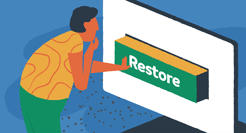 A person pushes a large green Restore button.