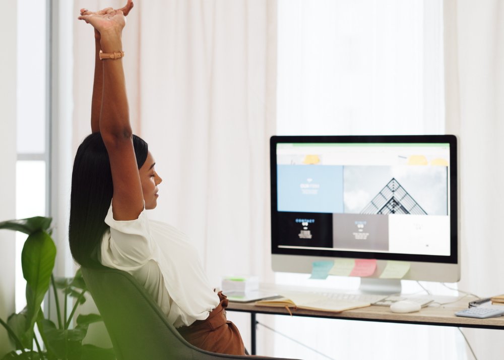 A WordPress developer sits at her desk. 