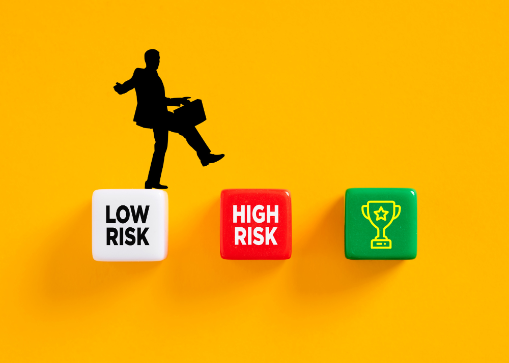 A man walks across dice for low risk and high risk activities, over a yellow background.