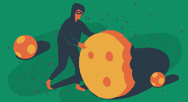 A hooded man tries to steal a giant cookie.