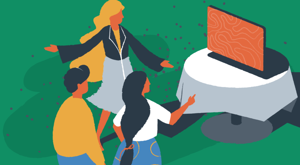 A host shows people to a computer screen on a table in dining room.